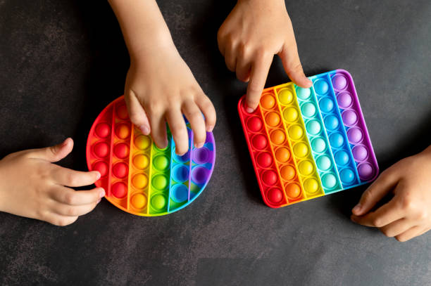 istock anti stress sensory pop it toys in a children's hands 1323706449