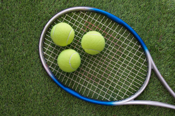 istock Tennis balls on racket 1323711248