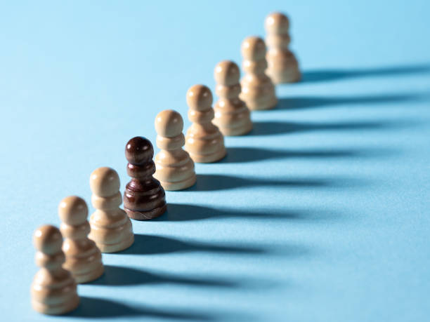 istock chess pieces in a row, white pawns on a blue background, 1323712360