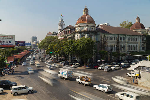 Yangon, Myanmar - December 19, 2019: Traffic jams in Yangon, in front of the Yangon Divisional Court building over Strand Road