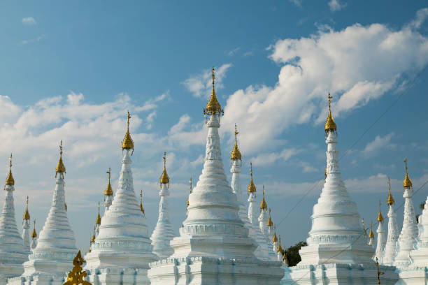 istock White Buddhist stupas in Sanda Muni Pagoda, Mandalay, Myanmar 1323713807