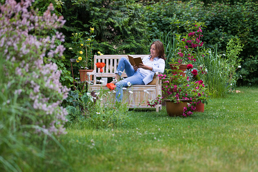 Shot of a senior woman relaxing at flower garden