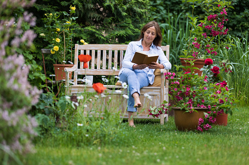 Shot of a senior woman relaxing at flower garden