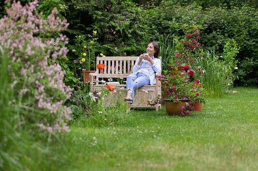 Gardening - Woman enjoy relaxing in the garden