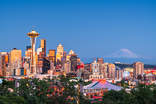 Seattle, Washington, USA downtown skyline at twilight with Mt. Rainier.