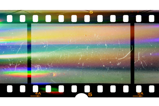 35mm positive filmstrip, first film frames on white background real scan of film material with cool scanning light interferences on the material 35mm movie camera stock pictures, royalty-free photos & images