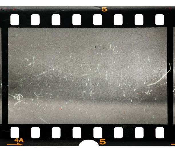 35mm film strip with empty or blank frame window vintage film with scratches and dust on white background 35mm movie camera stock pictures, royalty-free photos & images