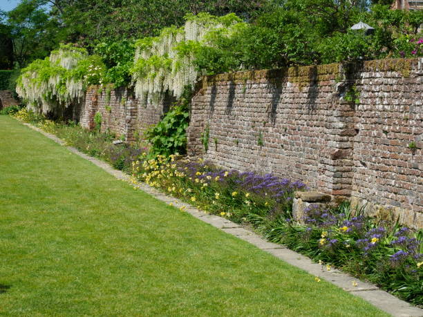 Old walled garden Tranquil landscape walled garden stock pictures, royalty-free photos & images