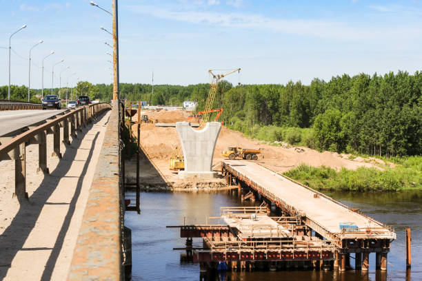 istock Construction of a new bridge next to the old bridge. 1323727451