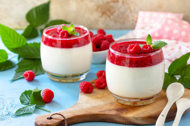 istock Italian dessert. Raspberry Panna cotta with raspberry jelly on a stone or concrete background, homemade cuisine. 1323731557