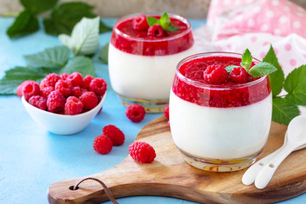 istock Italian dessert. Raspberry Panna cotta with raspberry jelly on a stone or concrete background, homemade cuisine. 1323731564