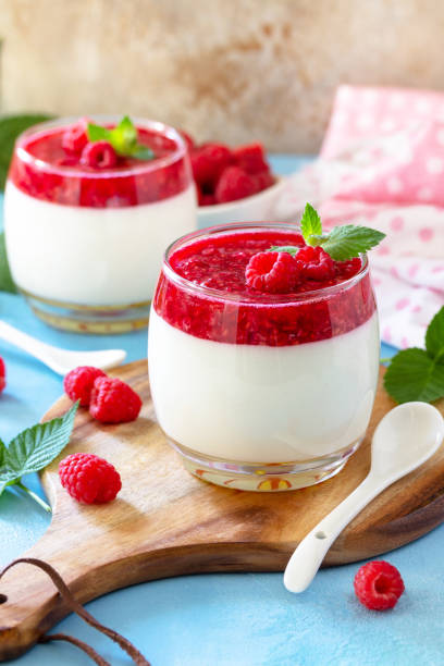 istock Italian dessert. Raspberry Panna cotta with raspberry jelly on a stone or concrete background, homemade cuisine. Copy space. 1323731565