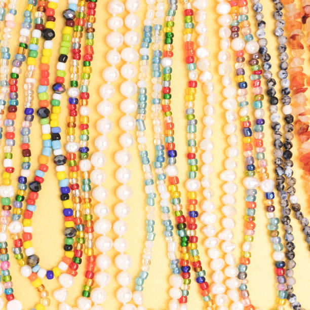 istock Closeup of necklaces made from multicolored beads and pearls. 1323734310