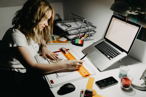 istock Young female working in his home office 1323736992