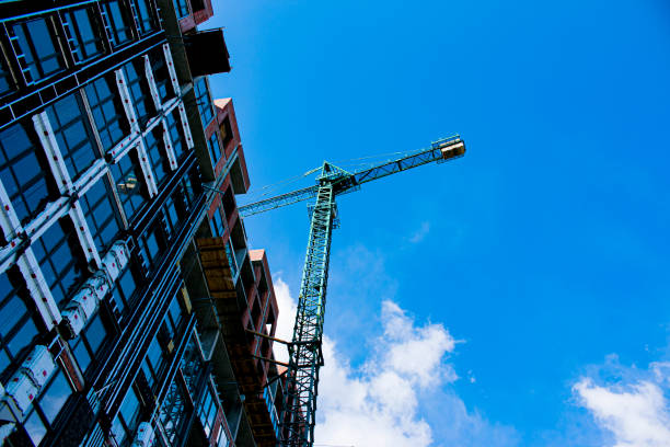 istock Crane and building construction. Construction of a large building 1323738203