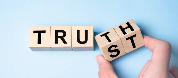 istock Truth instead of trust. Hand turns dice and changes the word Trust to Truth. 1323738710