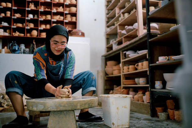 istock Young Hijab Women Working on Making Clay Objects in Pottery Workshop 1323738782