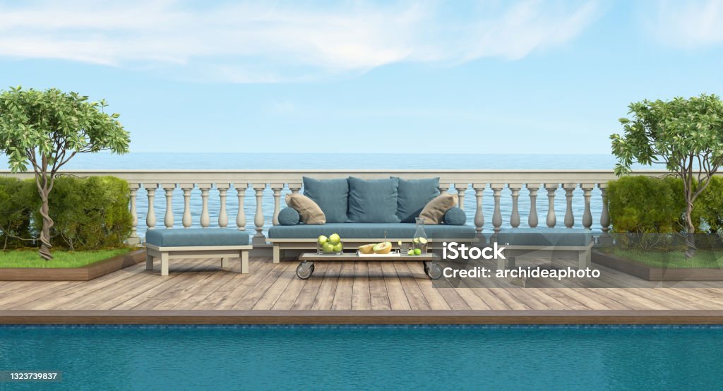 Retro style sofa and footstool by the pool in a garden with balustrade Garden with swimming pool and retro sofa in front of a classic balustrade - 3d rendering
Note: garden does not exist in reality, Property model is not necessary Balustrade Stock Photo