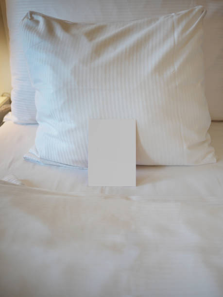 istock Blank greetings card on the bed with turn down service 1323741450