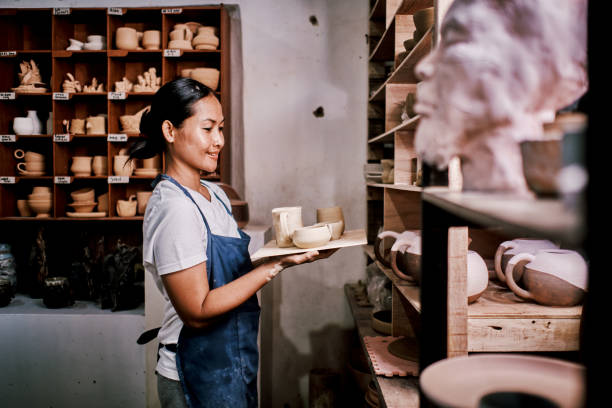 istock Young Woman Holding Pottery Vase She Made 1323741753