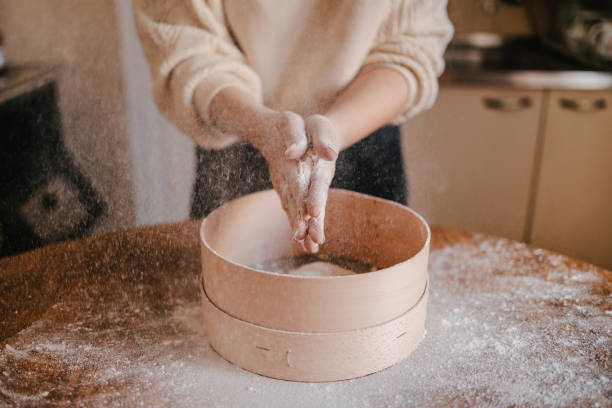 istock Woman shaking out flour from her hands 1323744483