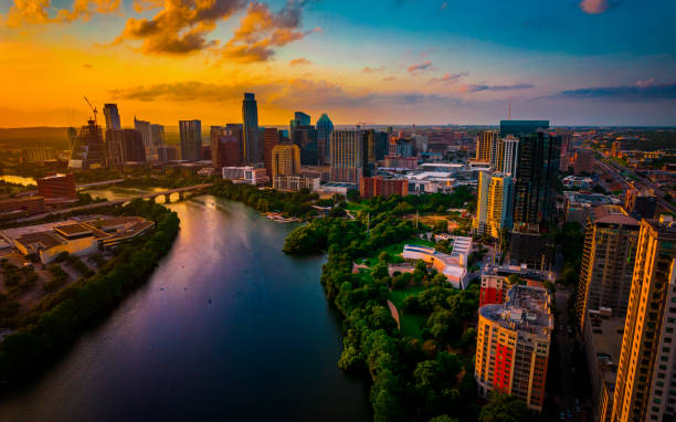 Sunset over Austin Texas Travel Destination of America Summer 2021 Amazing golden hour sunset over Town Lake , Austin Texas USA The Capital City of USA Travel Destination of America Summer 2021 colorado river photos stock pictures, royalty-free photos & images