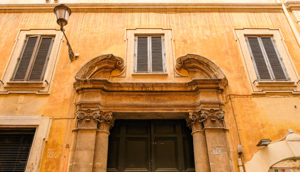 an ocher facade - imponent imagens e fotografias de stock