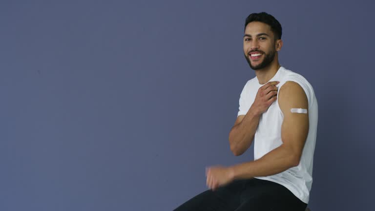 4k video footage of a man showing thumbs up after receiving the Covid-19 vaccine