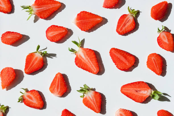 istock Sliced red strawberry background. Summer concept. 1323754619