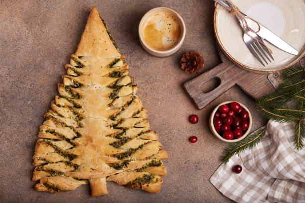 istock Christmas tree shape puff pastry pie with spinach and cheese 1323754700