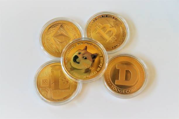 Crytocurrency San Diego, CA June 10, 2021  Close up of assorted cryptocurrencies like bitcoin, dogecoin, ethereum, litecoin on white background illustrating concept of exchange cryptocurrency, new virtual money shiba inu stock pictures, royalty-free photos & images