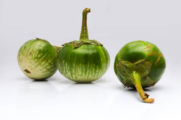 istock Green round eggplant isolated on white background 1323757846