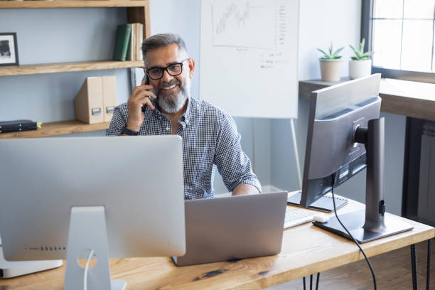 istock Mature businessman working from home office 1323757991