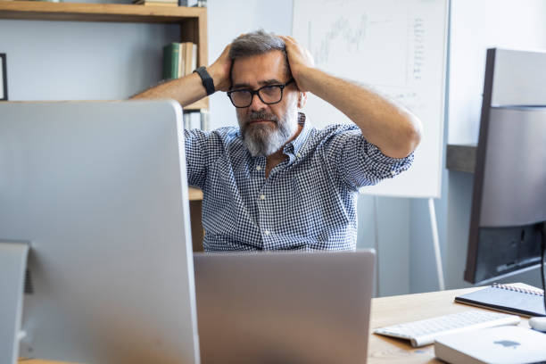 istock Mature businessman working from home office 1323758532