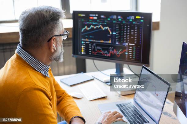 Mature Businessman Trading With Cryptocurrency Stock Photo - Download Image Now - Stock Market and Exchange, Cryptocurrency, Computer Monitor