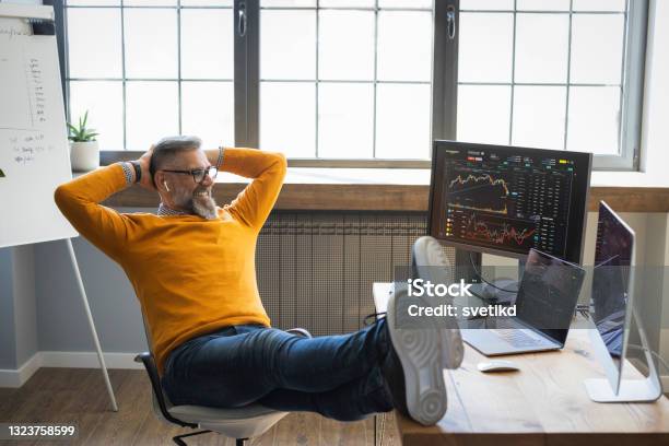 Mature Businessman Trading With Cryptocurrency Stock Photo - Download Image Now - Relaxation, Happiness, Stock Market and Exchange