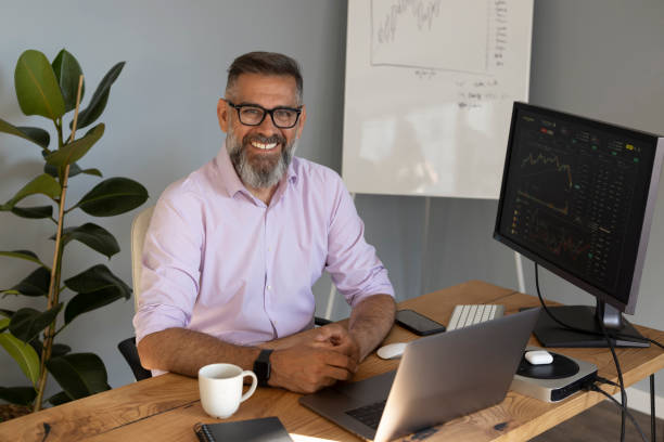 istock Mature businessman trading with cryptocurrency 1323758636