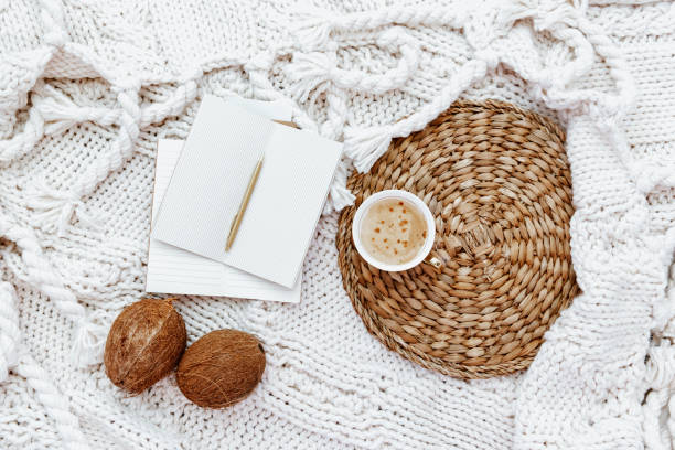Flat lay with coffee cup and blank notes on white background. beautiful female still life