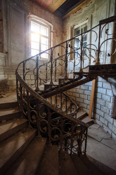 istock Old vintage spiral staircase at the old abandoned building 1323759765