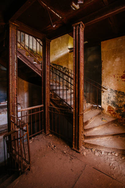 istock Old vintage spiral staircase at the old abandoned building 1323760786