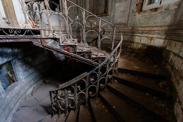 istock Old vintage spiral staircase at the old abandoned building 1323760787