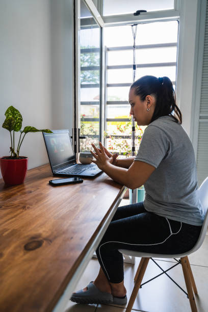 istock Young woman working from home having a conference call 1323763234