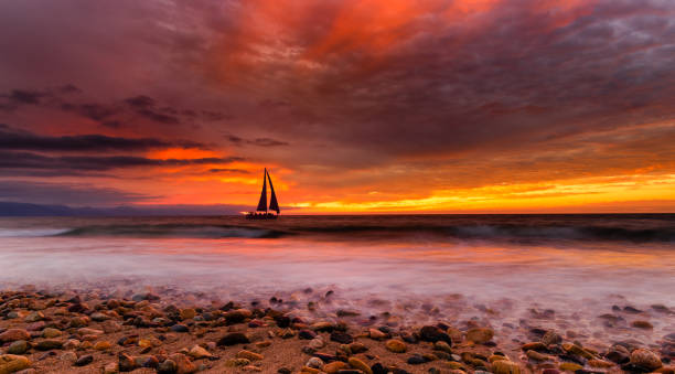 istock Colorful Sunset Sailboat Ocean Inspirational Landscape 1323766020