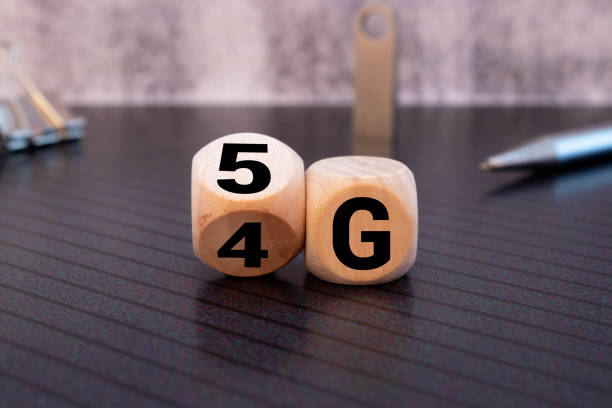 istock Man's Hand Changing Wooden Block From 4g To 5g On White Surface 1323767341