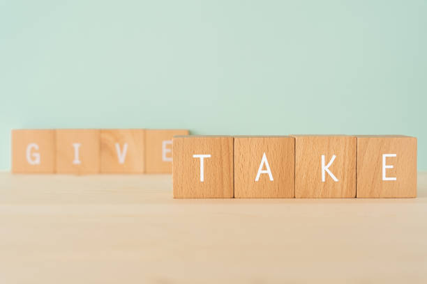 istock Give and take; Wooden blocks with 