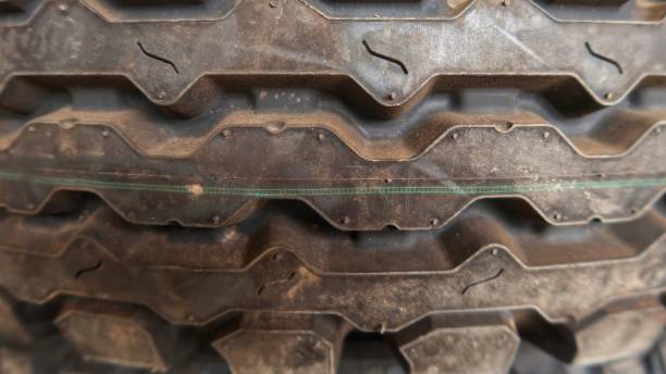 A Car Tyre or Car Tire is a ring-shaped component that surrounds a wheel's rim to transfer a vehicle's load from the axle through the wheel to the ground and to provide traction on the surface over which the wheel travels. un neumático de coche o neumático de coche es un componente en forma de anillo que rodea la llanta de una rueda para transferir la carga de un vehículo desde el eje a través de la rueda hasta el suelo y para proporcionar tracción en la superficie sobr