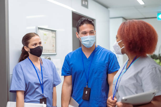 istock Multi-ethnic group of tired nurses in hospital setting 1323773494