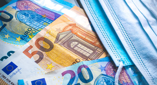 money, euro - eur. currency of the european union. euro banknotes and surgical masks. - european union euro note european union currency paper currency currency imagens e fotografias de stock