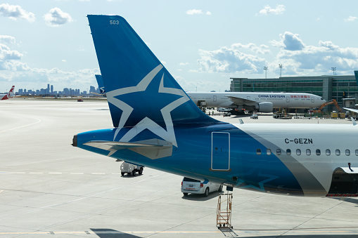 Air Transat, a Canadian global airline, logo is seen on a Airbus A321 while parked at Toronto Pearson Intl. Airport. Air Transat, who recently introduced a new logo and branding is on display on the aircraft.