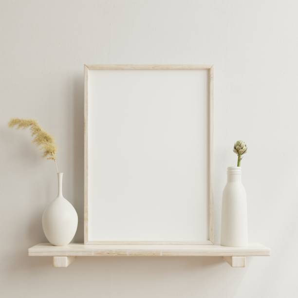 istock Interior poster mockup with vertical wooden frame in home interior background with vase. 1323779190